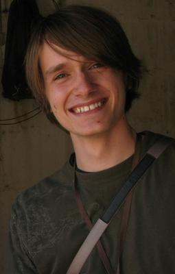 a man smiling at the camera