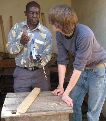 a man and a boy standing next to each other