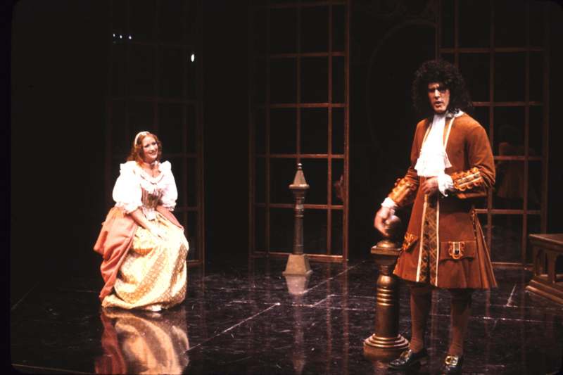 a man and woman in clothing on a stage