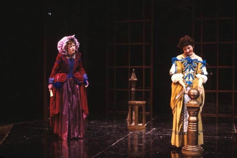 two women in clothing on a stage