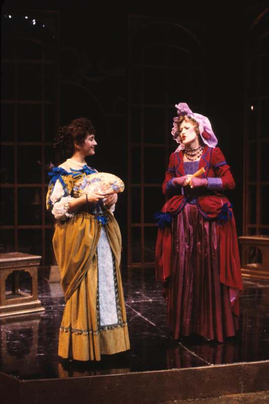 a couple of women in clothing on a stage