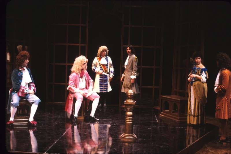 a group of people in clothing on a stage