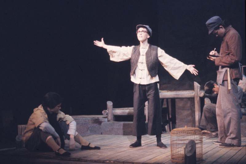a man in a garment on a stage