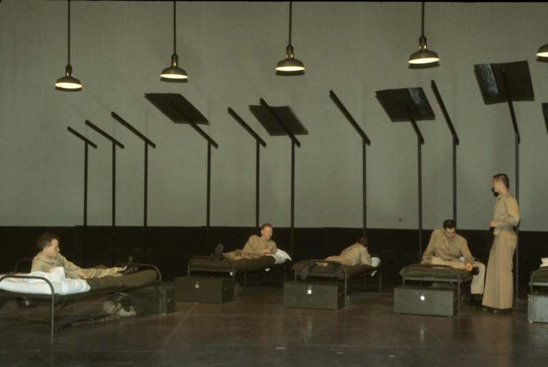 several people lying in beds