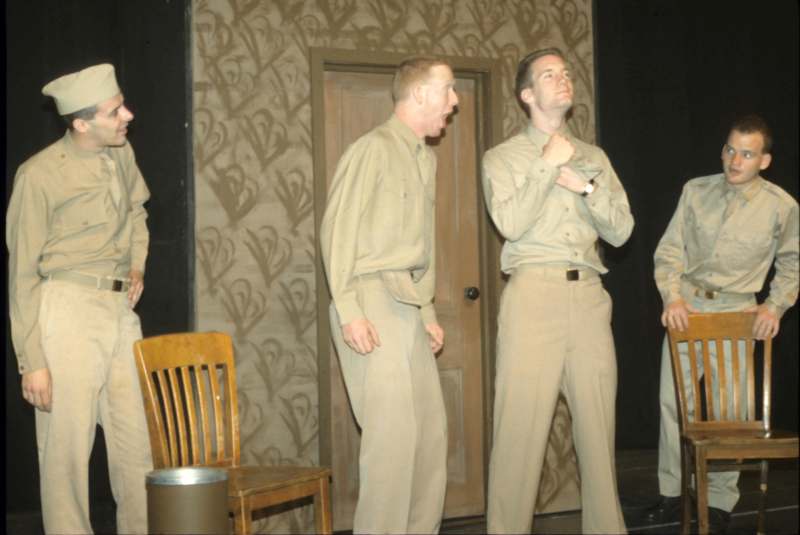 a group of men in khaki uniforms
