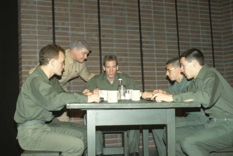 a group of men sitting around a table