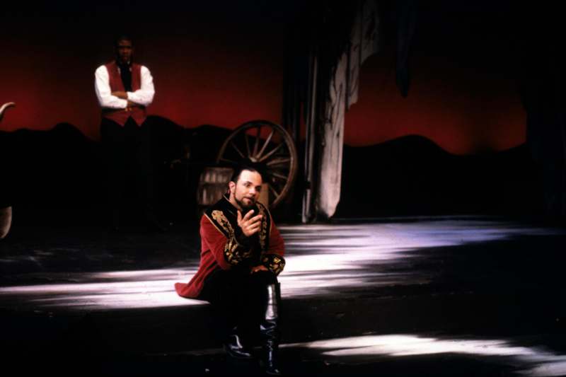 a man sitting on a stage