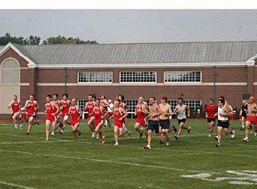 a group of people running on a field