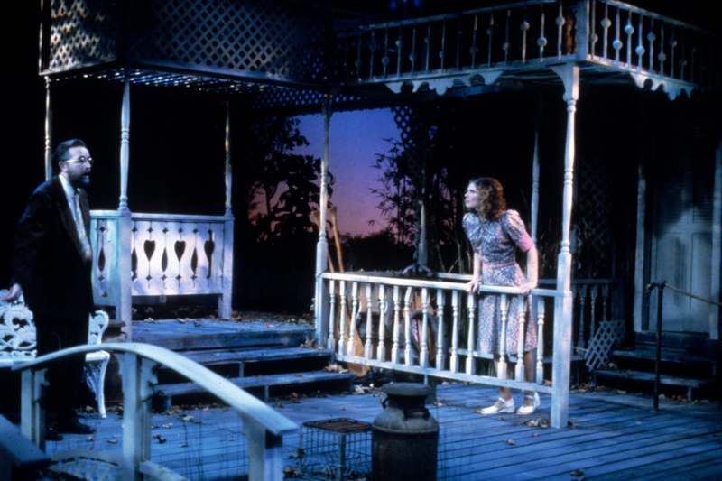 a woman standing on a porch