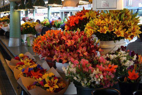 a group of flowers in a market