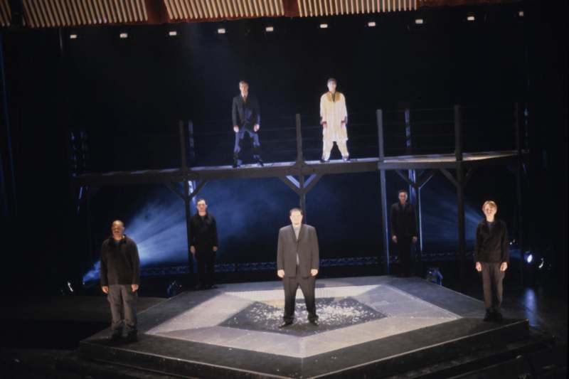 a group of men standing on a stage