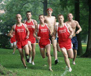 a group of men running on grass