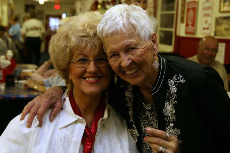 a pair of older women smiling