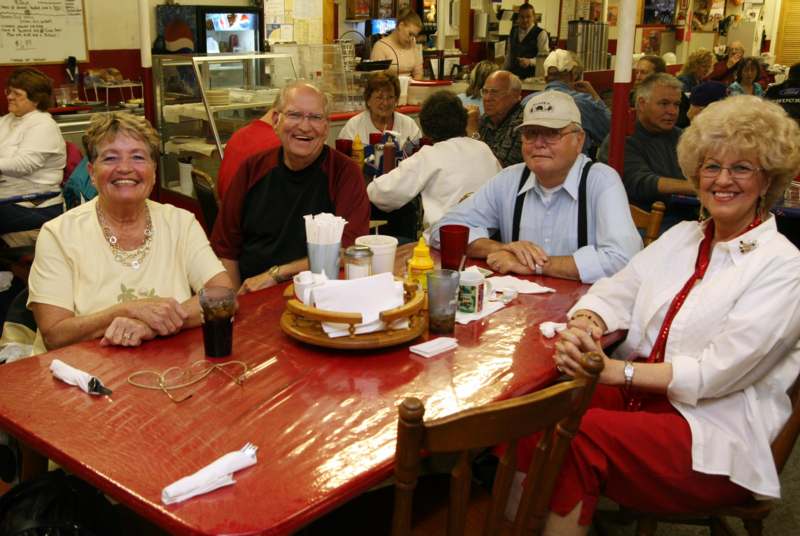 a group of people sitting at a table