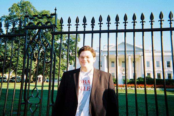 a man standing in front of a gate