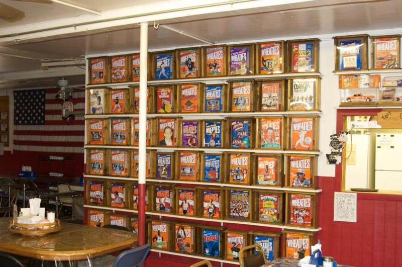 a wall of cereal boxes