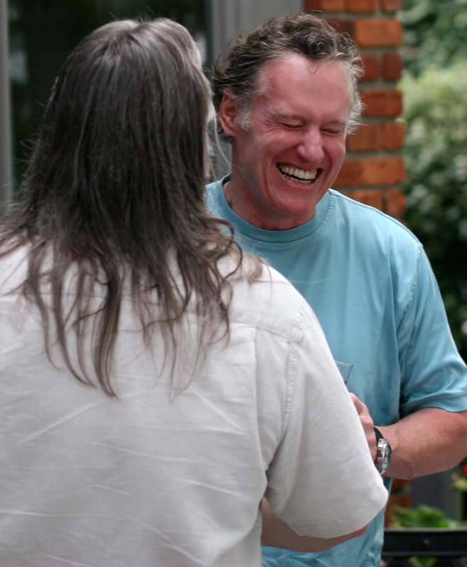 a man laughing with another man