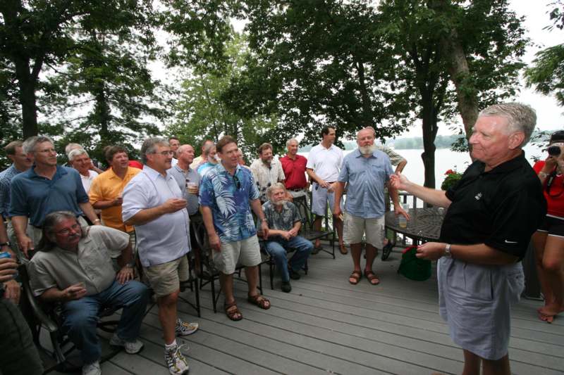 a group of people standing on a deck