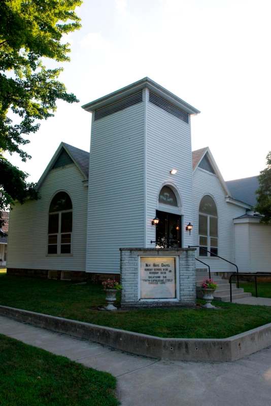 a white church with a sign