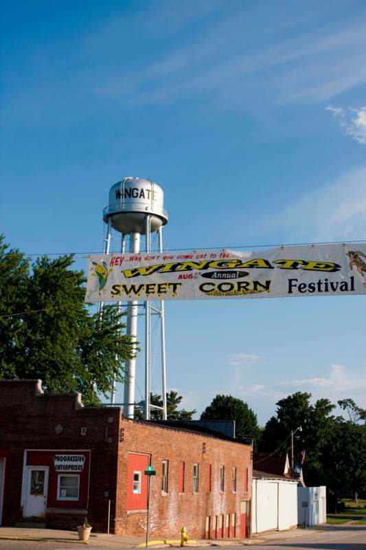 a water tower with a banner above it