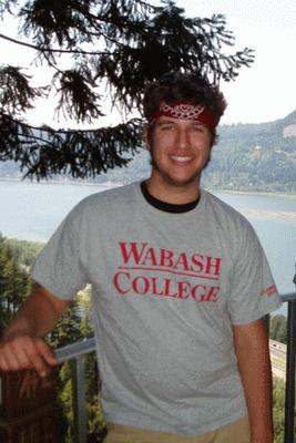 a man wearing a headband standing outside