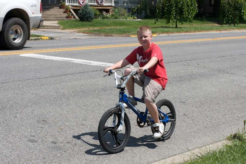 a boy riding a bicycle