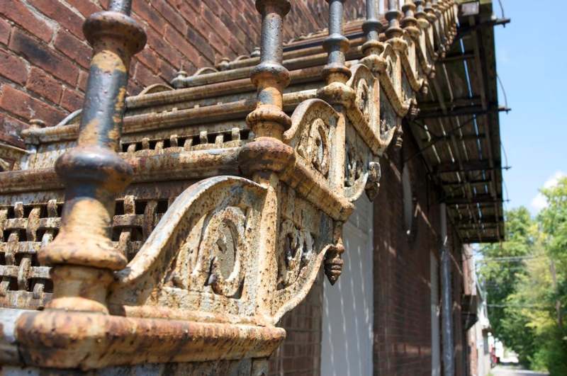 a rusty staircase outside of a building