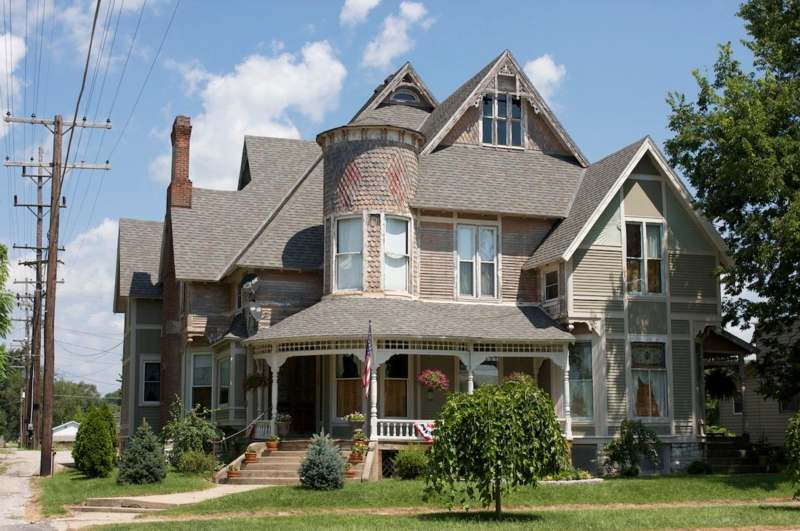 a large house with a porch with W. H. Stark House in the background