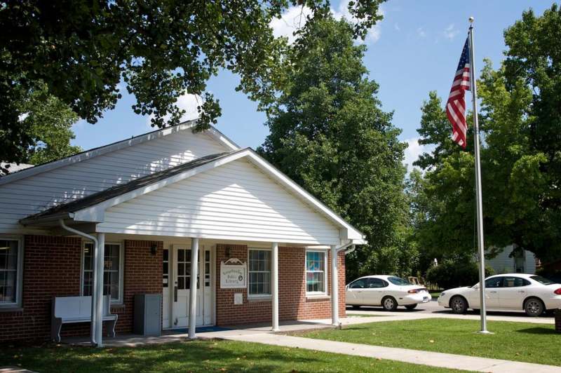 a building with a flag on the front