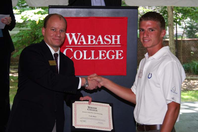 a man shaking hands with another man