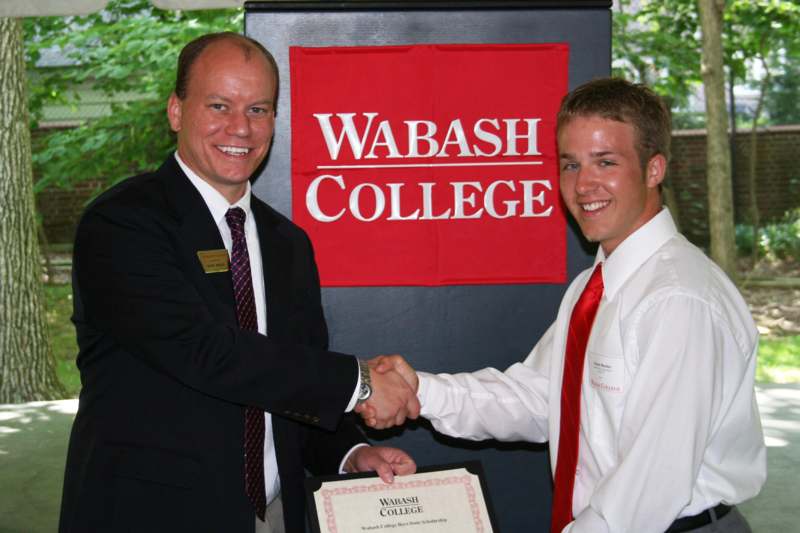 a man shaking hands with another man