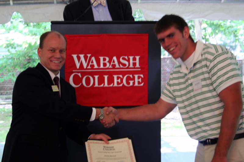 a man shaking hands with another man