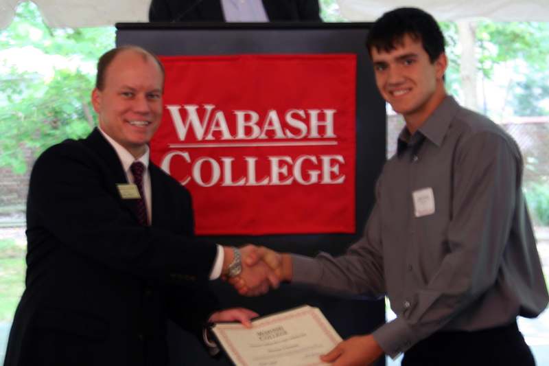 a man shaking hands with another man