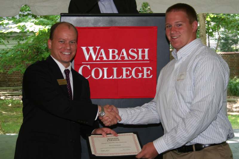 a man shaking hands with another man
