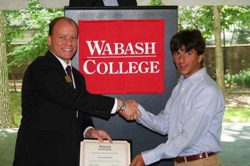 a man shaking hands with another man