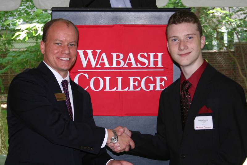 a man shaking hands with another man