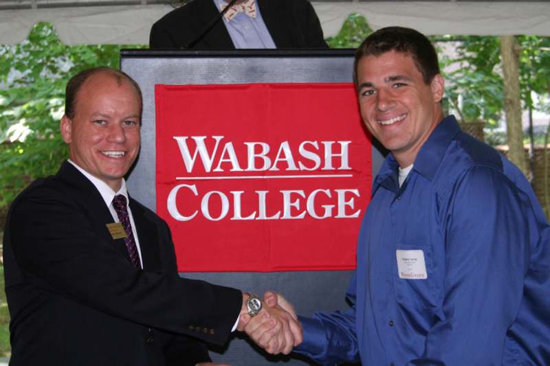 a couple of men shaking hands