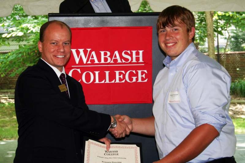 a man shaking hands with another man