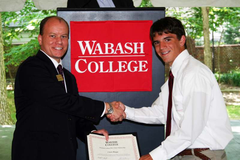 a man shaking hands with another man