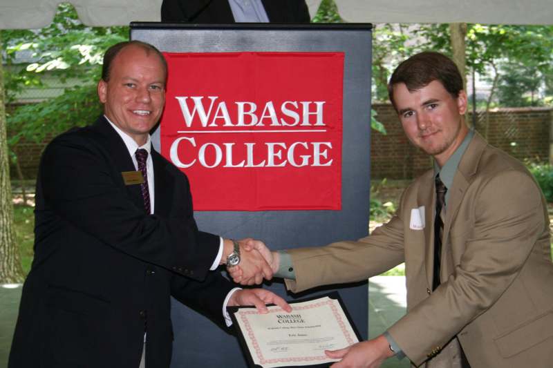a man shaking hands with another man