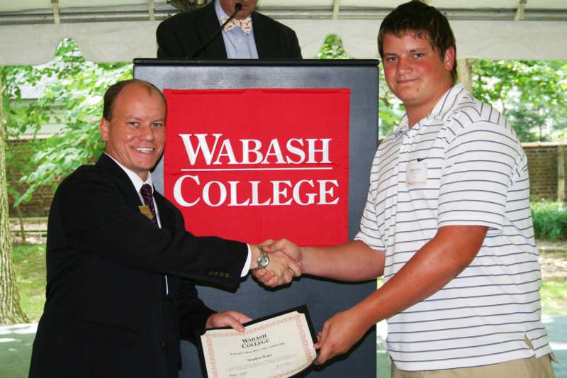 a man shaking hands with another man