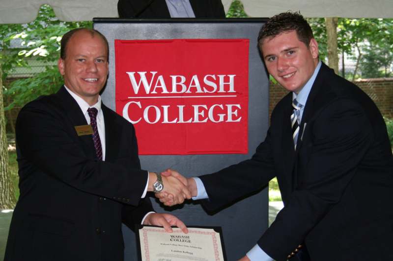 a couple of men shaking hands
