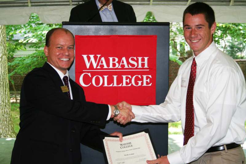 a couple of men shaking hands
