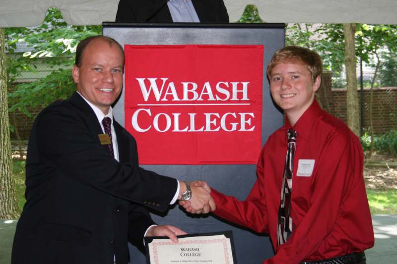 a man shaking hands with another man