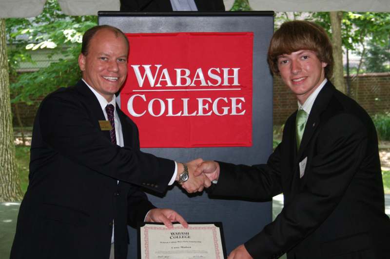 a couple of men shaking hands