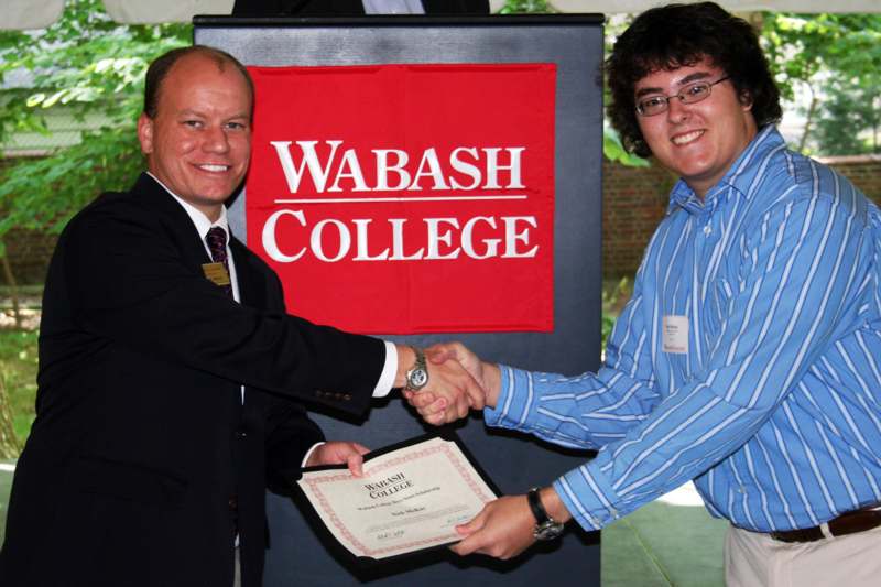 a man shaking hands with another man