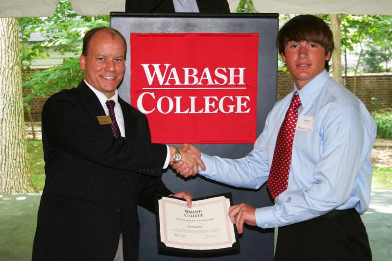 a man shaking hands with another man