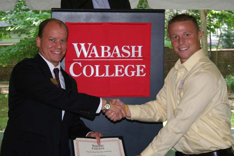 a man shaking hands with another man
