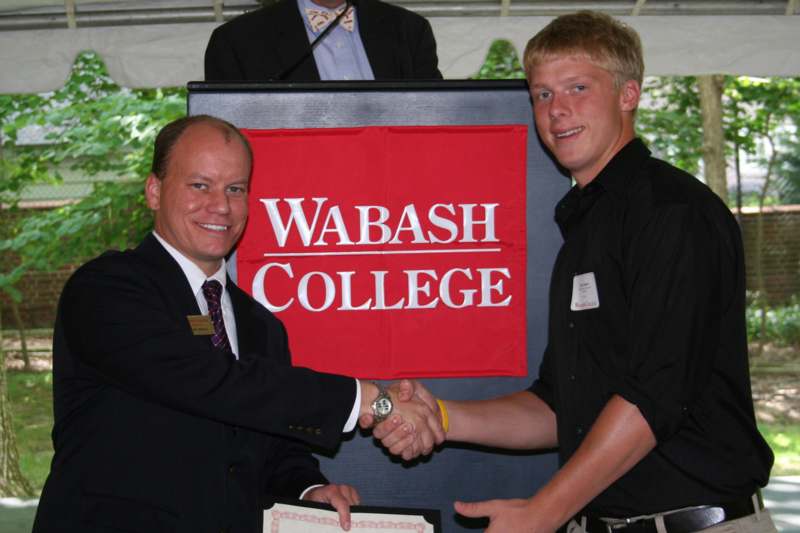 a man shaking hands with another man