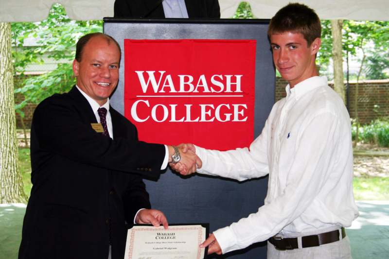 a man shaking hands with another man